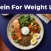 An overhead view of a balanced high protein meal on a plate with a measuring scale.