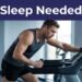 A tired male runner takes a break on a treadmill inside a gym.