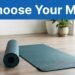 Two blue yoga mats and a water bottle sit in a bright home workout space.