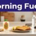 A dawn kitchen counter with a banana, toast, applesauce, water bottle, and running shoes beneath a Morning Fuel banner.
