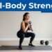 Woman doing a goblet squat on a yoga mat with dumbbells beside her.