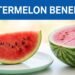 A red watermelon slice on a white plate beside a sliced watermelon half.