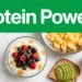 Greek yogurt, eggs, avocado toast, soy milk, and almonds on a marble counter.