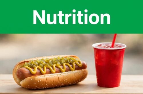 A loaded hot dog beside a red soda cup under a green Nutrition banner.